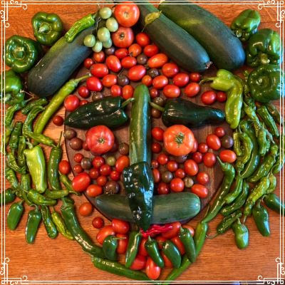 Tomatoes and peppers arranged into a face