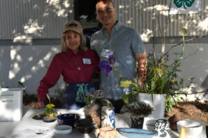 Flower Arranging demonstration. Table with containers and plants